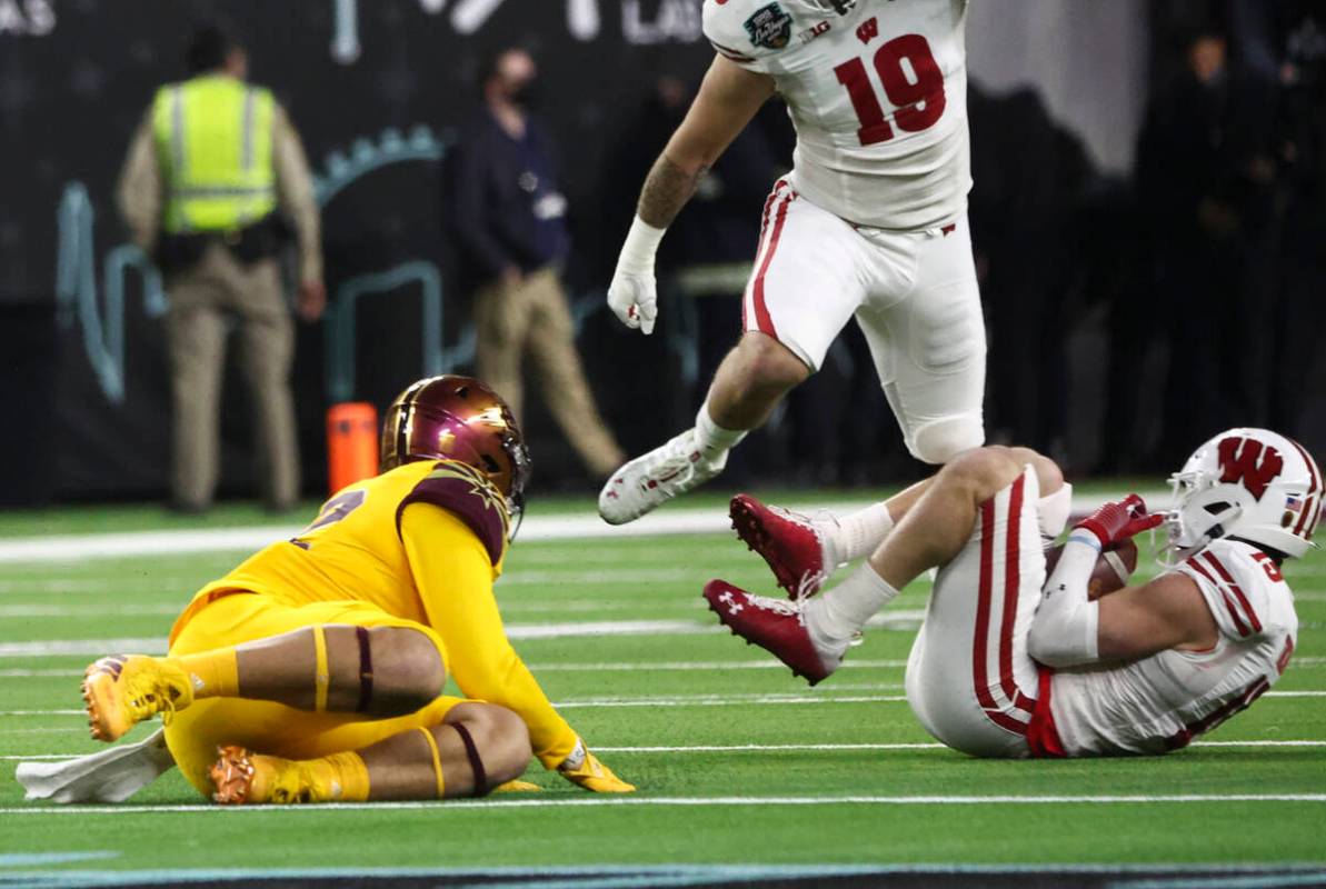 Wisconsin Badgers safety John Torchio (15) intercepts a pass from the Arizona State Sun Devils ...