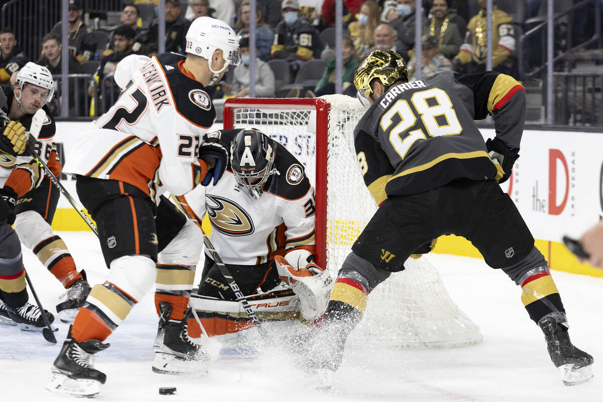 Golden Knights right wing Evgenii Dadonov (63), at left out of frame, passes to left wing Willi ...