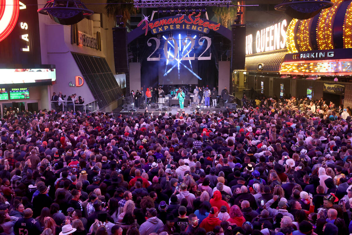 Revelers watch Tone Loc on the Third Street Stage on New Year's Eve at the Fremont Street Exper ...