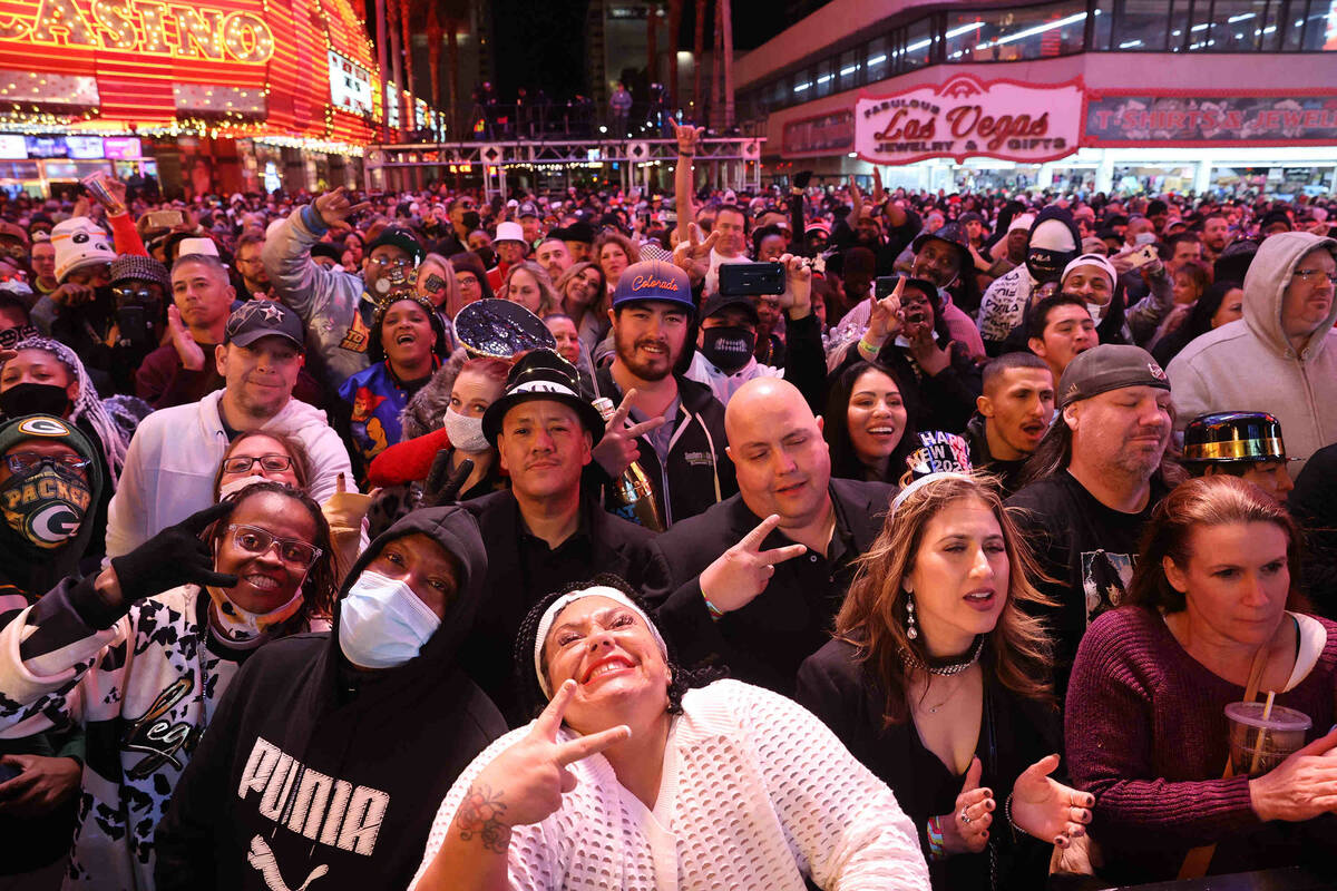 Fans react during a Bobby Brown performance on New Year's Eve at the Fremont Street Experience ...