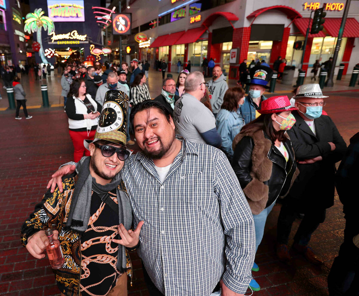 Brothers Miguel Carmona, left, and Arte Carmona of Los Angeles wait in line to get into the New ...