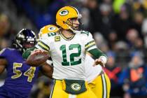 Green Bay Packers quarterback Aaron Rodgers (12) in action in the first half of an NFL football ...
