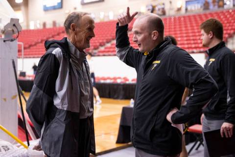 Bill Scoble, left, a member of UNLV's first basketball coaching staff, speaks with men’s ...