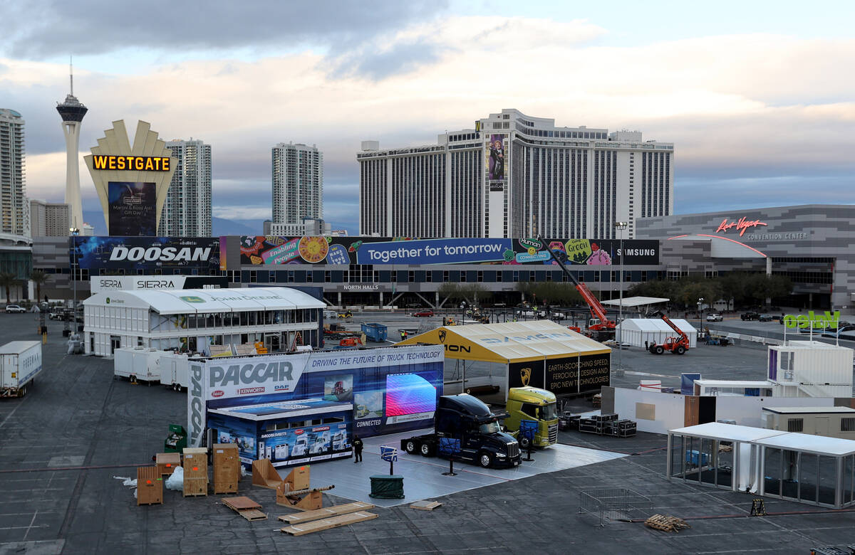 Workers prepare for CES at the Las Vegas Convention Center Thursday, Dec. 30, 2021. The trade s ...