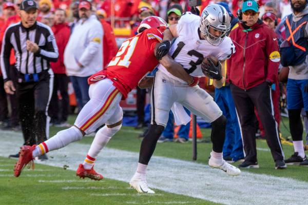 Raiders wide receiver Hunter Renfrow (13) is forced out of bounds by Kansas City Chiefs cornerb ...