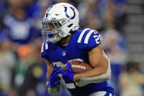 Indianapolis Colts running back Jonathan Taylor (28) runs with the ball during the first half o ...