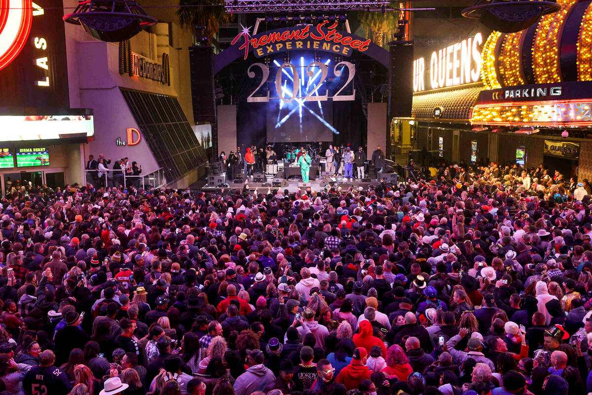 Revelers watch Tone Loc on the Third Street Stage on New YearÕs Eve at the Fremont Street ...