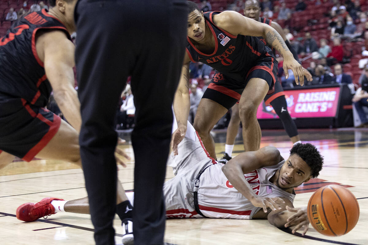 UNLV Rebels guard Bryce Hamilton (13) passes from the court while San Diego State Aztecs guard ...