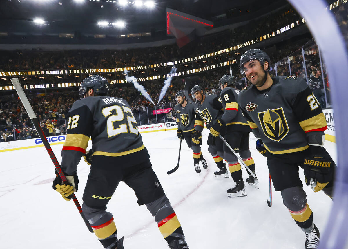 The Golden Knights celebrate a goal by Michael Amadio (22) during the first period of an NHL ho ...
