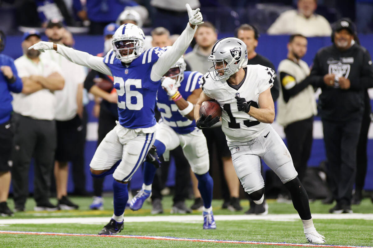 Raiders wide receiver Hunter Renfrow (13) runs leaving behind Indianapolis Colts cornerback Roc ...