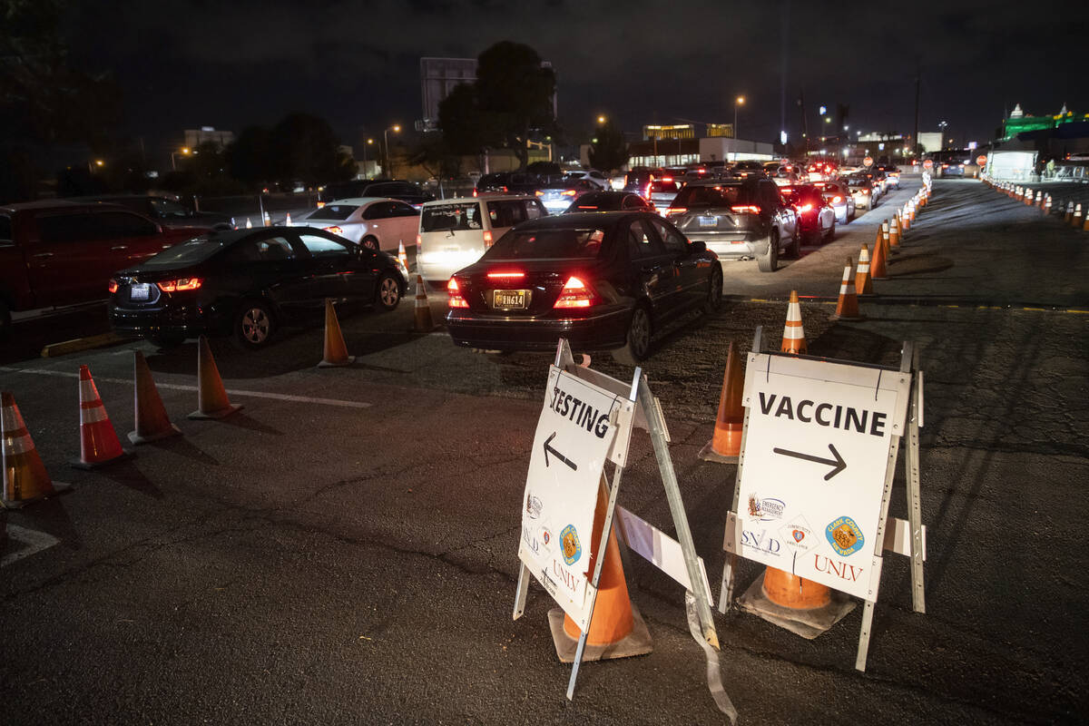 Traffic is backed up for blocks at a drive-thru and walk-up COVID-19 testing site at UNLV Parad ...