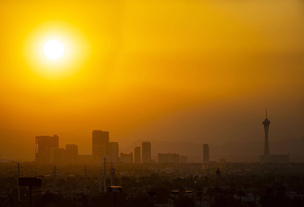 The sun shines through smoke and haze over the north end of the Las Vegas Strip in Las Vegas on ...