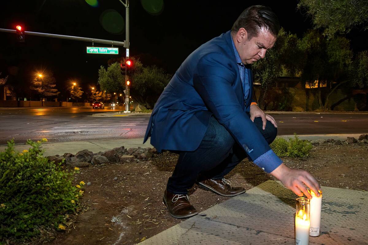 Andrew Bennett, public information officer with Zero Fatalities, stands after leaving a lighted ...