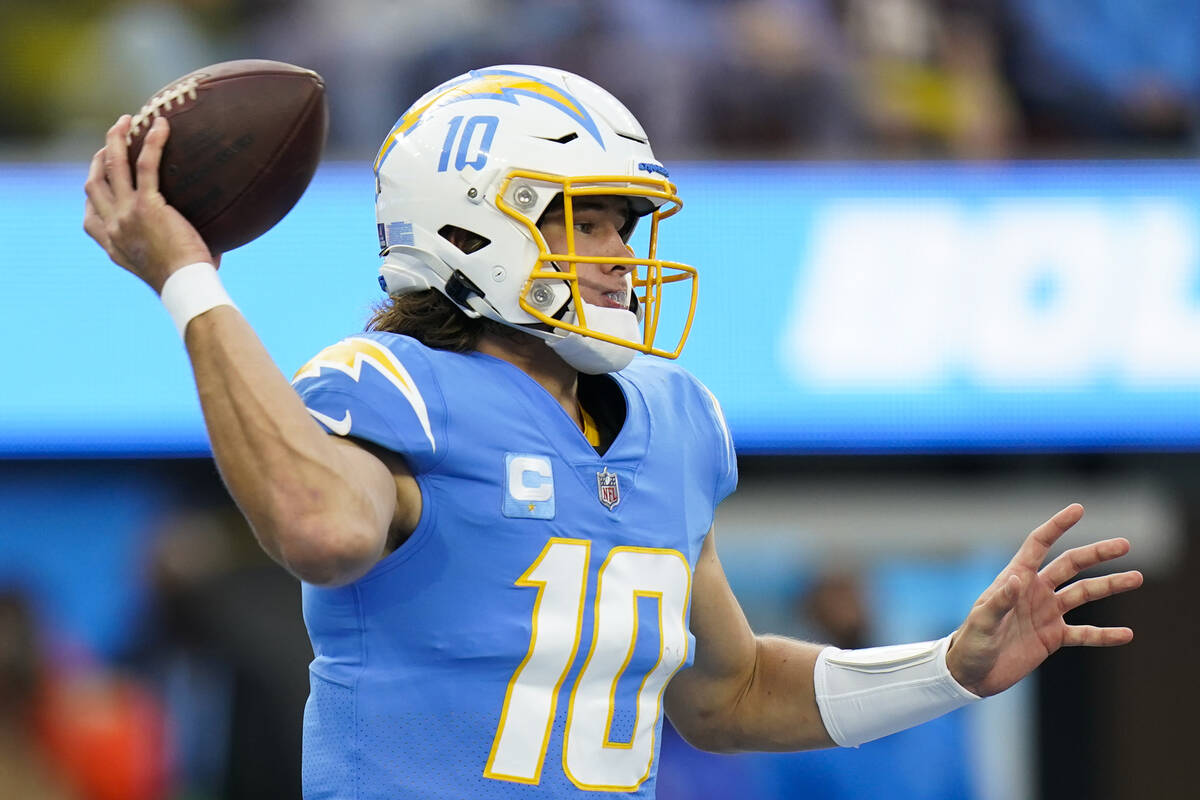 Los Angeles Chargers quarterback Justin Herbert throws a pass during an NFL football game again ...