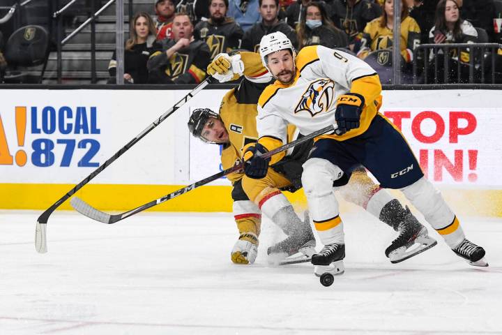 Vegas Golden Knights defenseman Alex Pietrangelo, left, and Nashville Predators left wing Filip ...