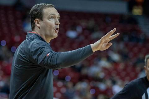 UNLV Rebels head coach Kevin Kruger signals another play to his players versus the San Diego To ...