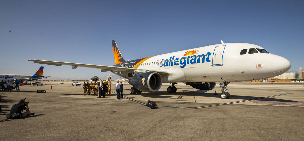 Dignitaries and team members gather as Allegiant unveils a new Golden Knights-themed plane at M ...