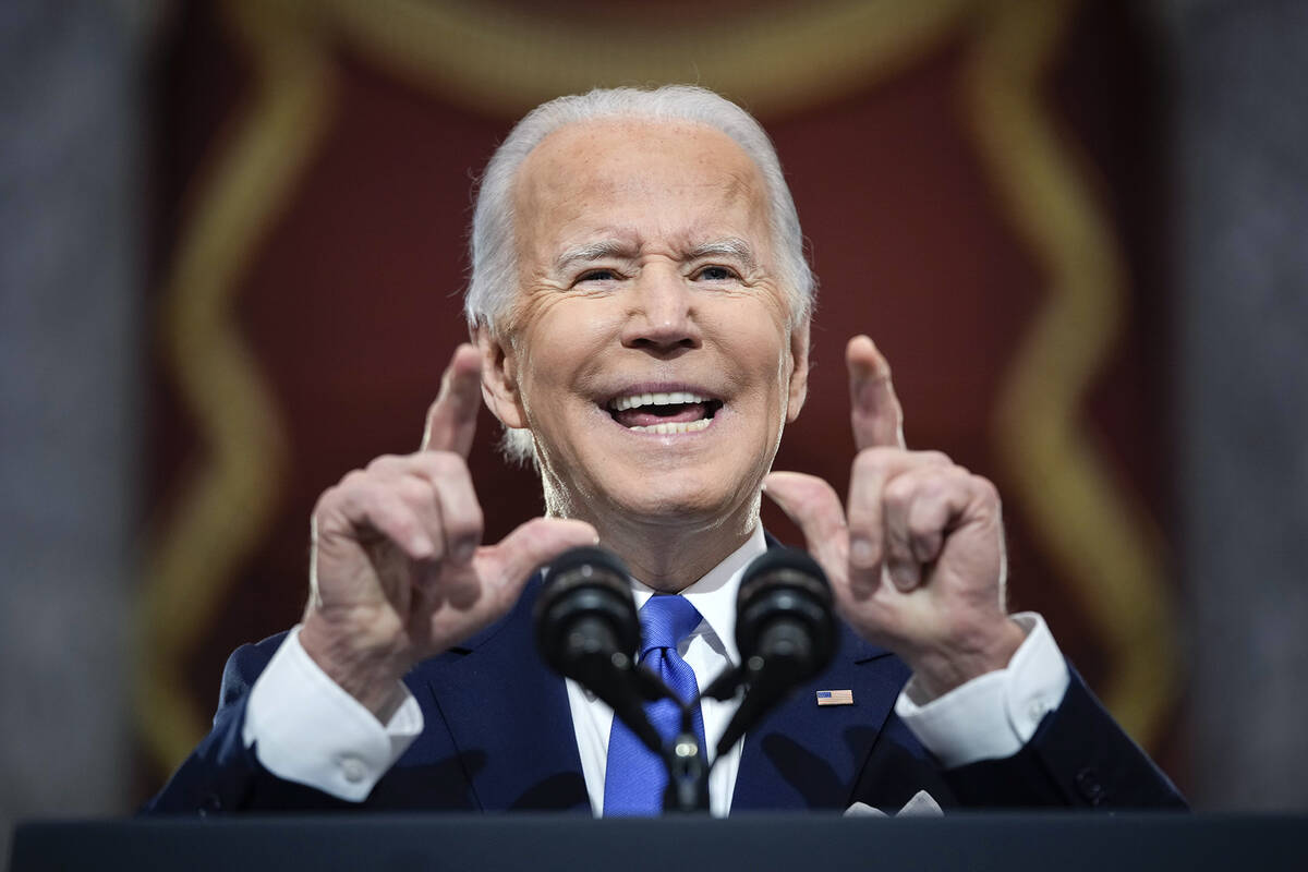 President Joe Biden speaks from Statuary Hall at the U.S. Capitol to mark the one year annivers ...