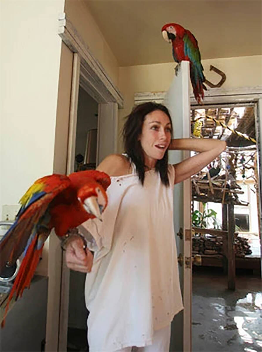 Pahrump resident Heidi Fleiss, seen with two of her more than two dozen pet birds. (Las Vegas R ...