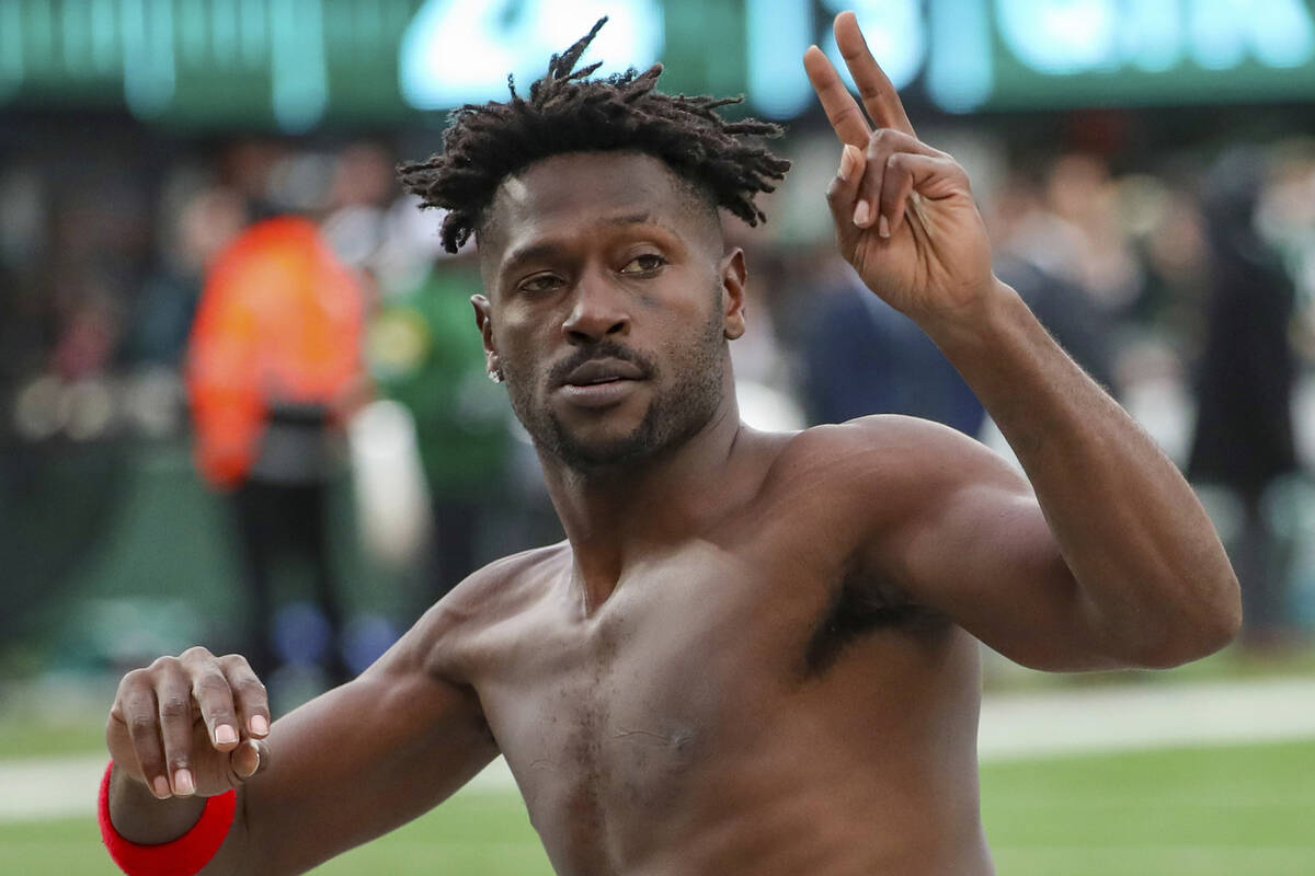 Tampa Bay Buccaneers wide receiver Antonio Brown (81) gestures to the crowd as he leaves the fi ...