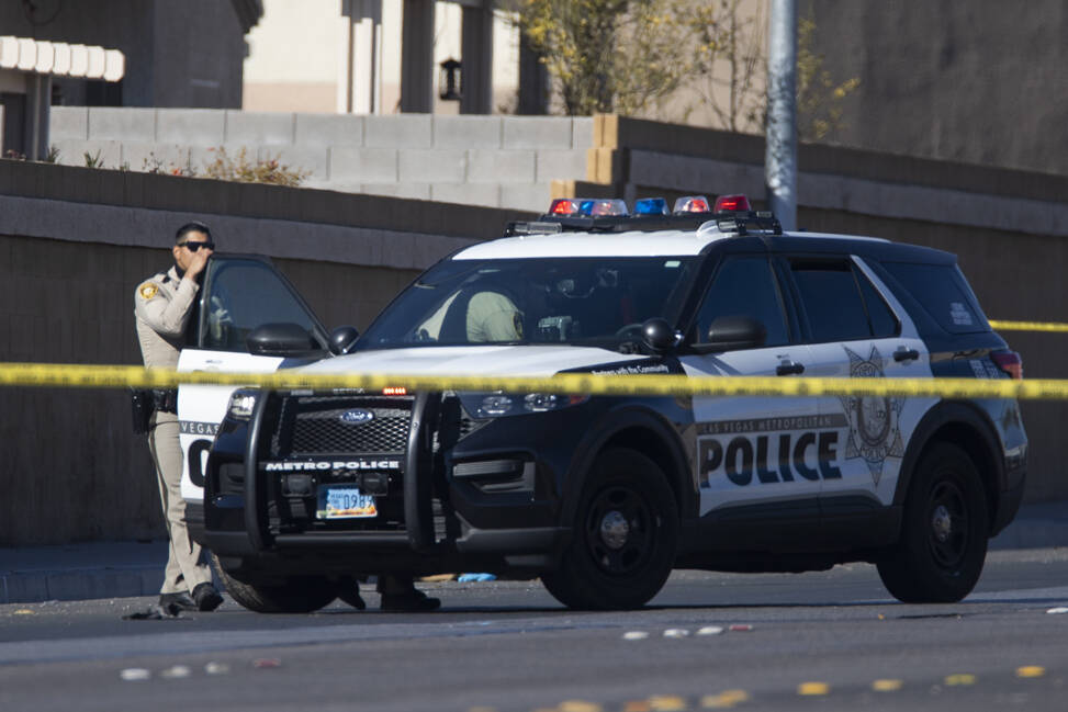 Las Vegas police investigate the scene of an officer involved shooting near the intersection o ...