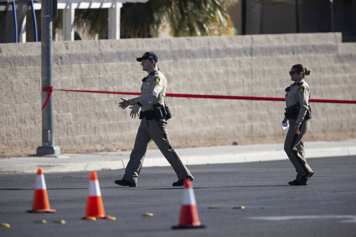 Las Vegas police investigate the scene of an officer involved shooting near the intersection o ...