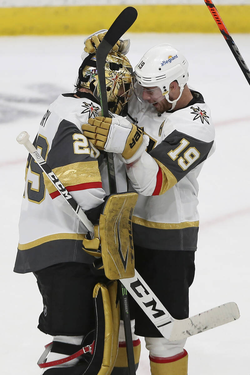 Vegas Golden Knights' goalie Marc-Andre Fleury (29) celebrates with Reilly Smith (19) after the ...