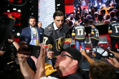Vegas Golden Knights' Marc-Andre Fleury signs autographs following a roundtable after the NHL A ...