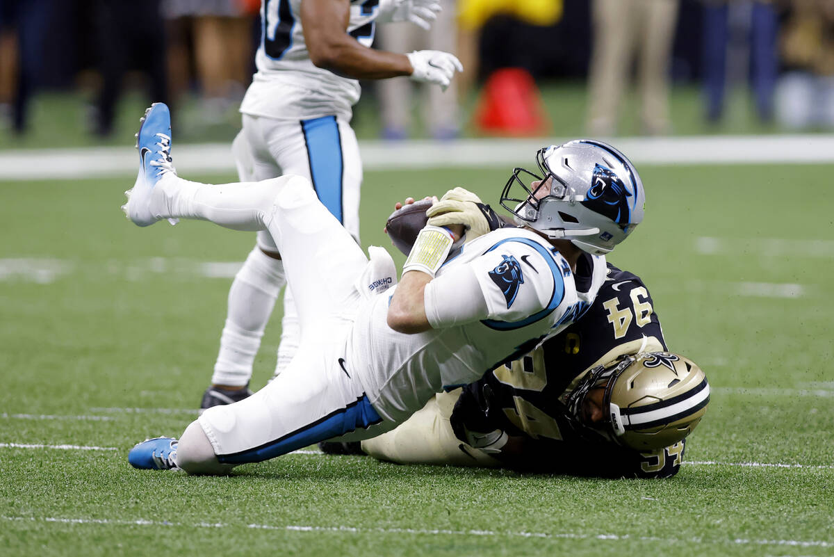 Carolina Panthers quarterback Sam Darnold (14) is sacked by New Orleans Saints defensive end Ca ...