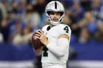 Raiders quarterback Derek Carr (4) looks for an open pass against the Indianapolis Colts in the ...