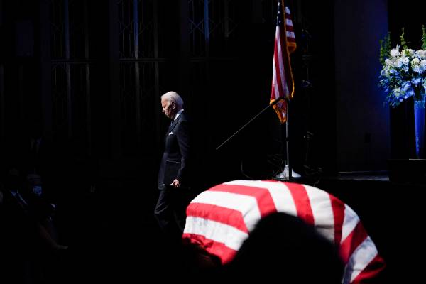 President Joe Biden walks by the flag-draped casket of former Senate Majority Leader Harry Reid ...