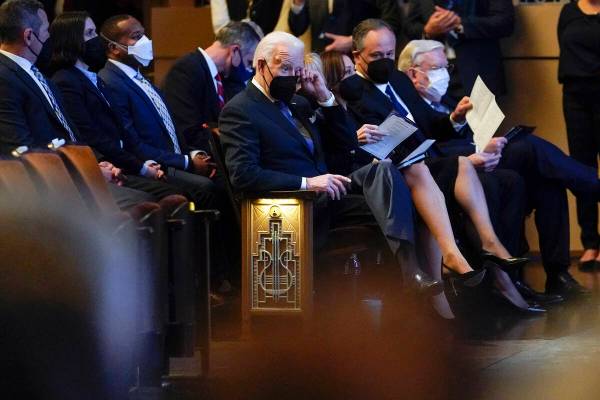 President Joe Biden wipes his eye as he attends a memorial service for former Senate Majority L ...