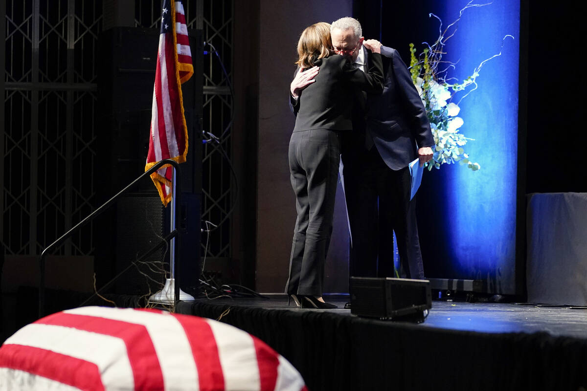 Senate Majority Leader Chuck Schumer of N.Y., hugs House Speaker Nancy Pelosi of Calif., as he ...