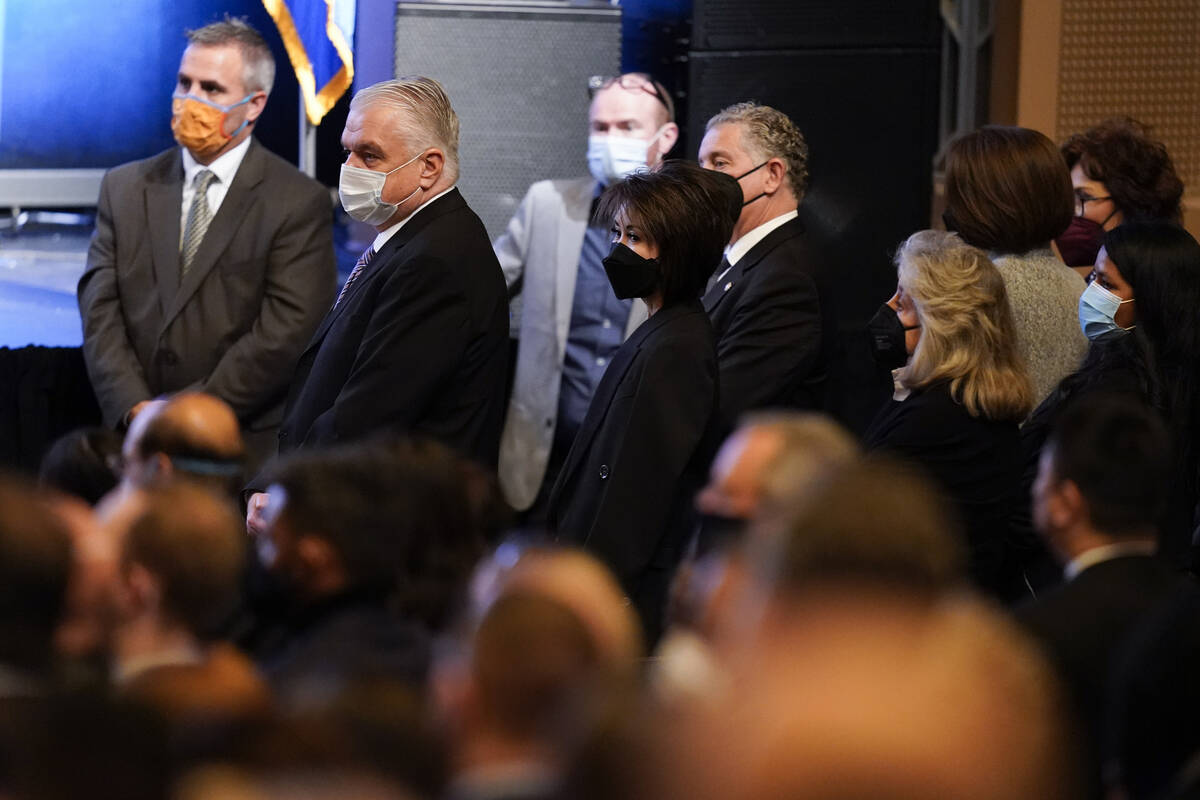 Nevada Gov. Steve Sisolak, second from left, attends a memorial service for former Senate Major ...