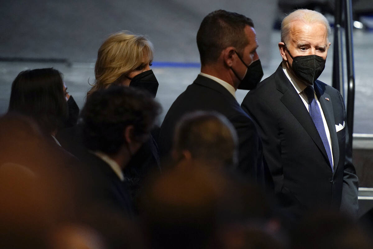 President Joe Biden and first lady Jill Biden arrive for a memorial service for former Senate M ...