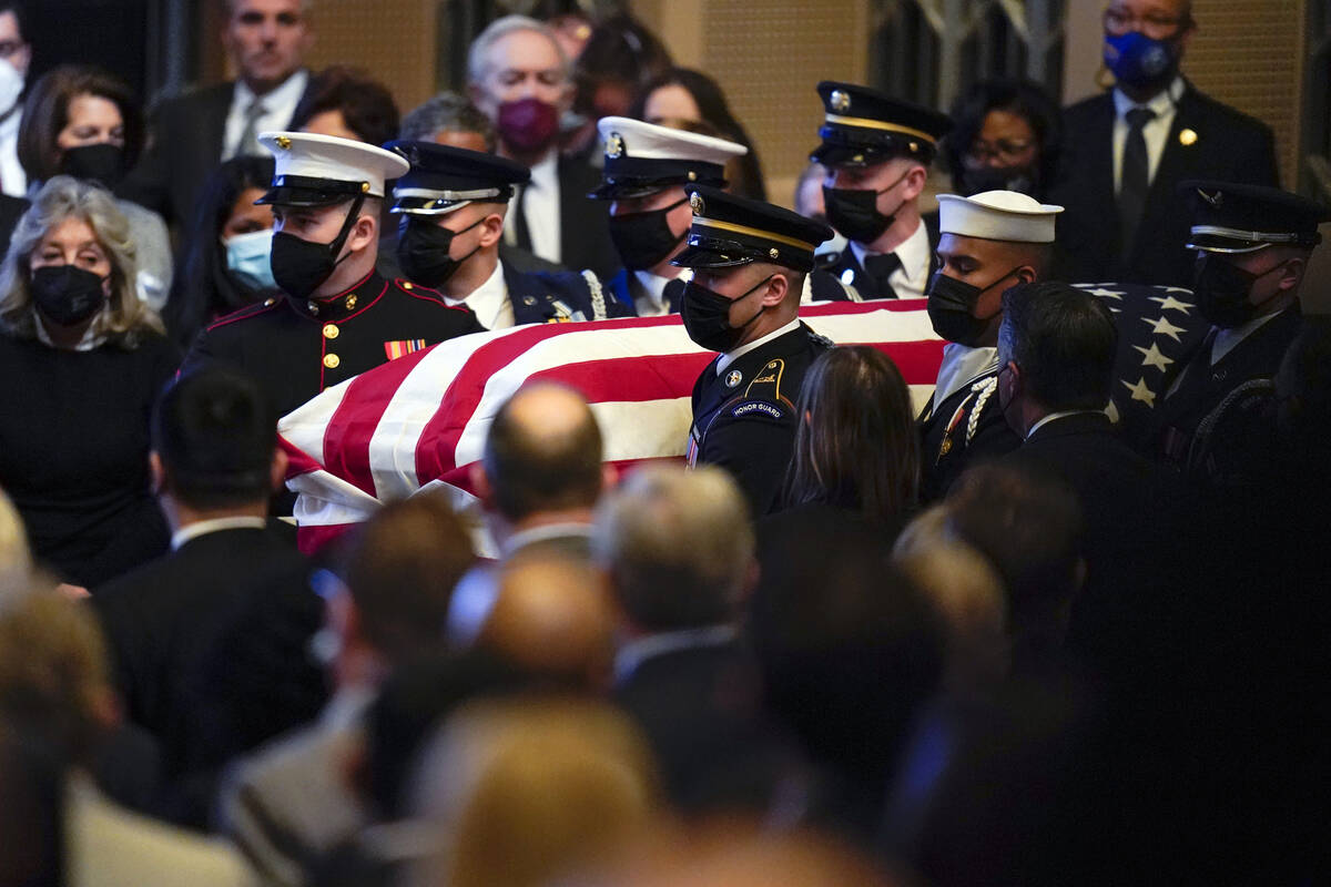 A military honor guard carries the flag-draped casket of former Senate Majority Leader Harry Re ...