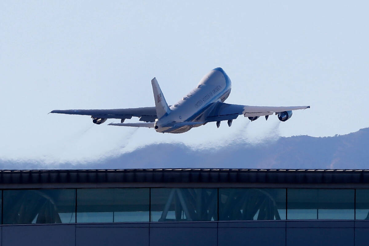 Air Force One, carrying President Joe Biden, flies away from Harry Reid International Airport, ...