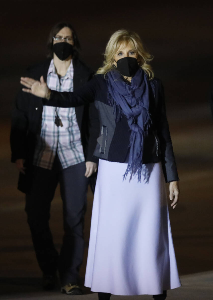 First lady Jill Biden waves after she arrived with President Joe Biden on Air Force One at Harr ...