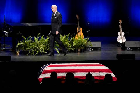 President Joe Biden leaves the stage after speaking during a memorial service for former Senate ...