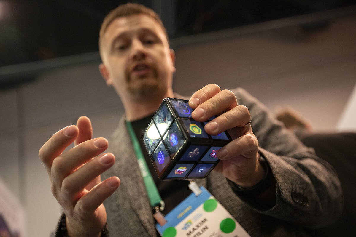 CEO and co-founder of WowCube Max Filin explains the company’s digital cube during the t ...
