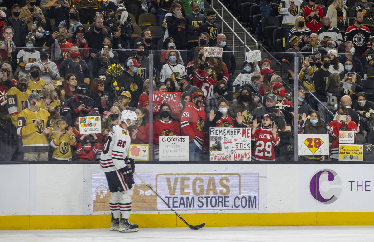 Chicago Blackhawks right wing Brett Connolly (20) skates past a host of Chicago Blackhawks goal ...