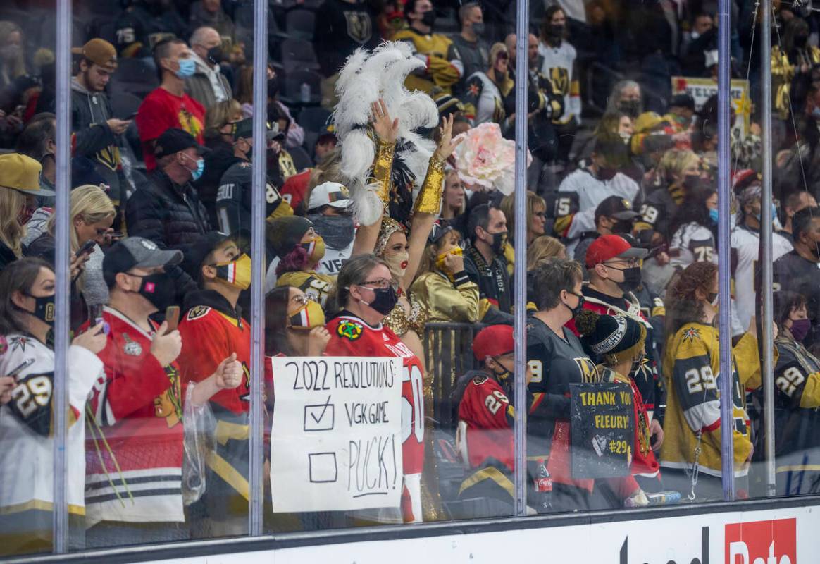 Fans sport a host of Chicago Blackhawks goaltender Marc-Andre Fleury (29) signs and jerseys dur ...