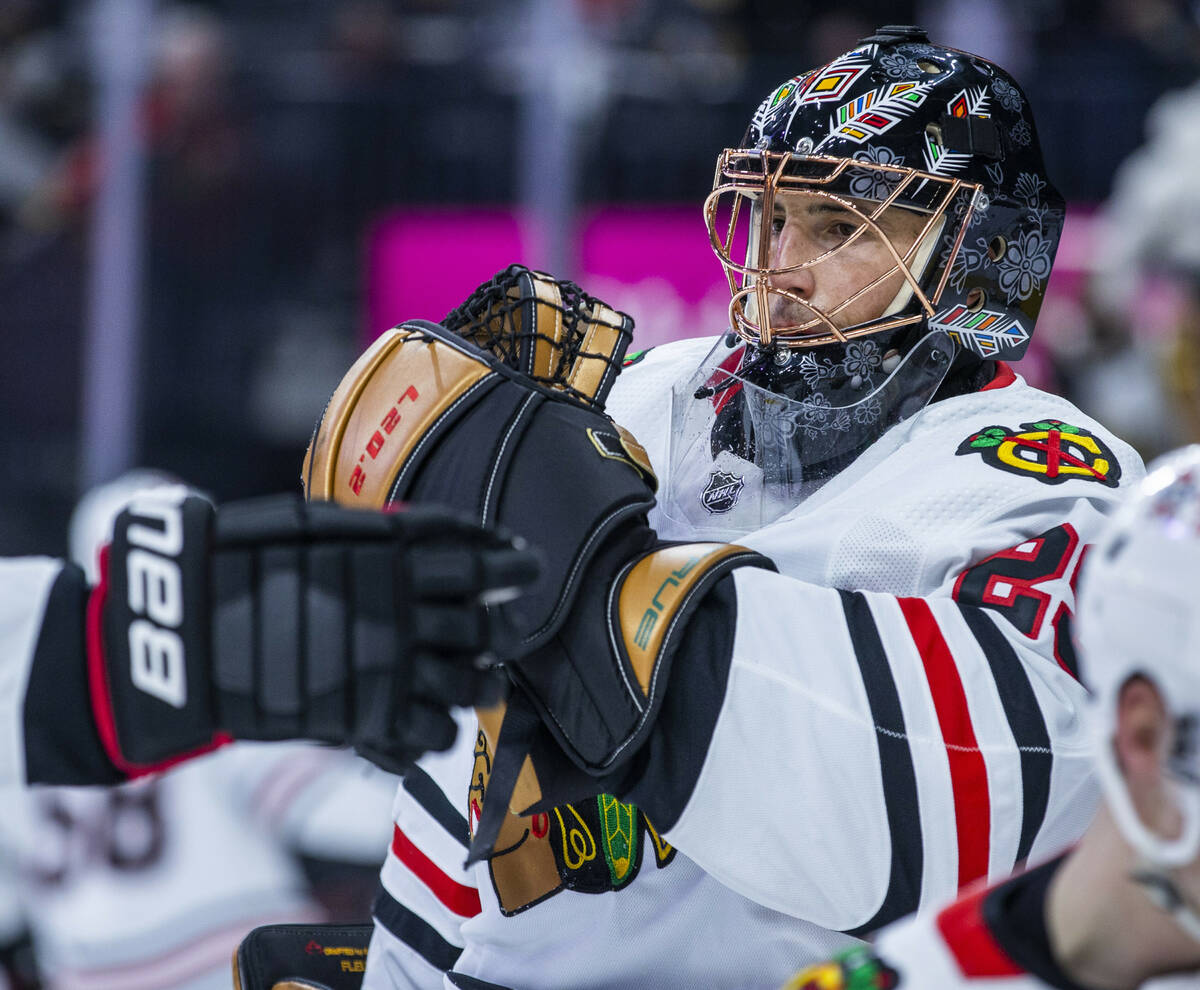 Chicago Blackhawks goaltender Marc-Andre Fleury (29) greets a teammate during warm ups before t ...