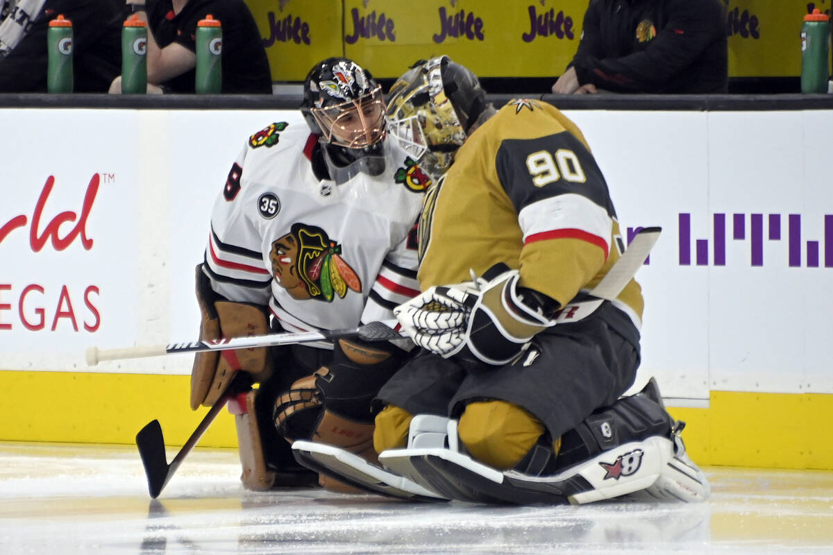 Chicago Blackhawks goaltender Marc-Andre Fleury, left, and Vegas Golden Knights goaltender Robi ...