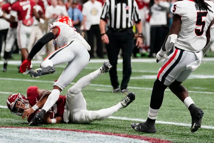 Alabama quarterback Bryce Young (9) scores a touchdown during the first half of the Southeaster ...