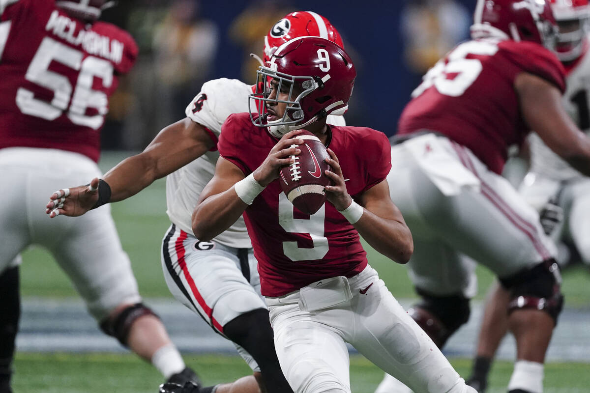 FILE - Alabama quarterback Bryce Young (9) works against Georgia during the second half of the ...