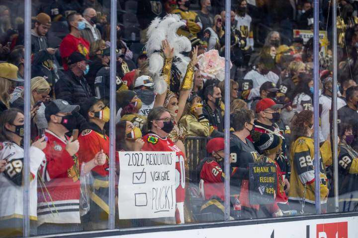 Fans sport a host of Chicago Blackhawks goaltender Marc-Andre Fleury (29) signs and jerseys dur ...