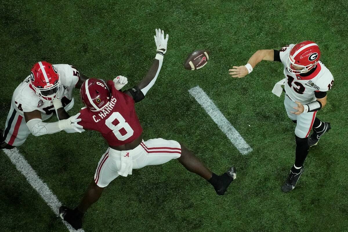 Georgia's Stetson Bennett thorws a pass during the first half of the College Football Playoff c ...