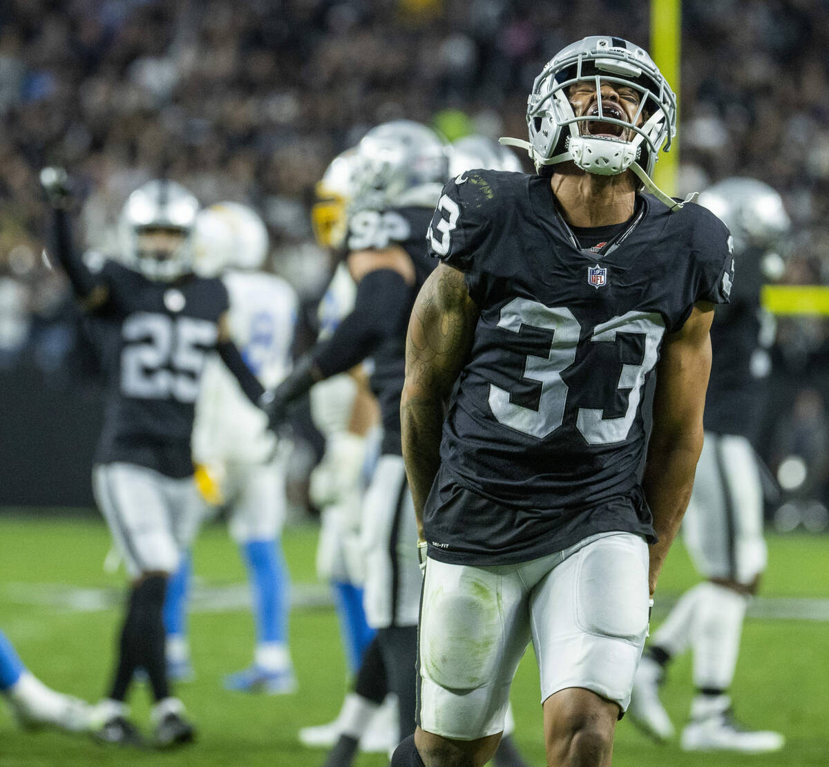 Raiders safety Roderic Teamer (33) celebrates another critical stop versus the Los Angeles Char ...