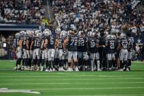 The Raiders meet in the center of the field before an NFL football game against the Dallas Cowb ...